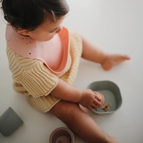 mushie Silicone Baby Bib, Adjustable Fit Waterproof Bibs (Powder Pink Confetti)