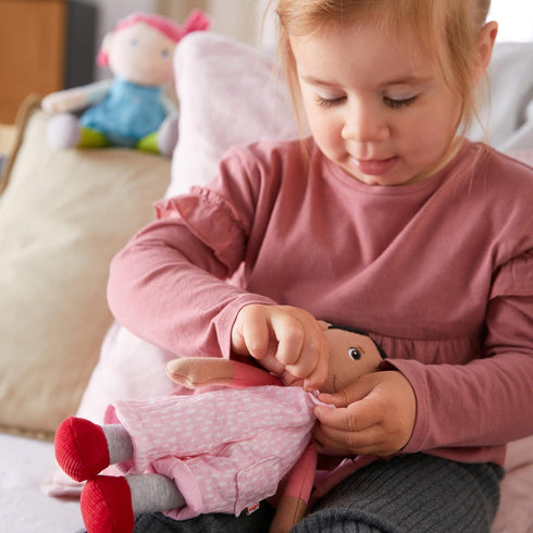 HABA Snug Up Doll Rumbi, 10" Soft Doll with Black Hair and Pink Overalls, Machine Washable for 18 Months and Up
