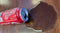 Generic Fake Spilled cola drink, prank, joke, gag from recycled soda cans