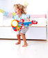 Hape 6-in-1 Music Maker - Colorful Guitar Shaped Musical Toy with 6 Instruments for Ages 18 Months+