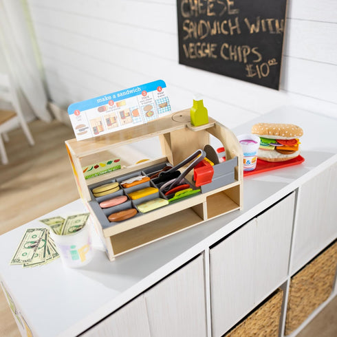 Melissa & Doug Wooden Slice & Stack Sandwich Counter with Deli Slicer – 56-Piece Pretend Play Food Set
