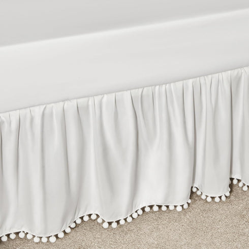 TILLYOU Ruffled Baby Crib Skirt with Pompoms, 28”x 52”, 14'' Drop, White for Girls and Boys