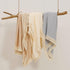 insular Cotton Muslin Baby Blanket with Tassel, Boho Muslin Swaddle Blanket, 47" x 40”, Khaki