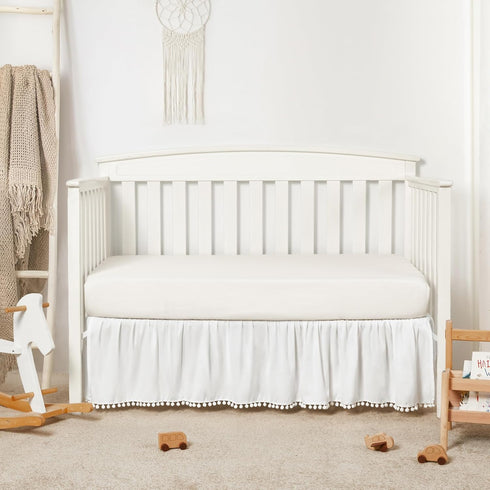 TILLYOU Ruffled Baby Crib Skirt with Pompoms, 28”x 52”, 14'' Drop, White for Girls and Boys