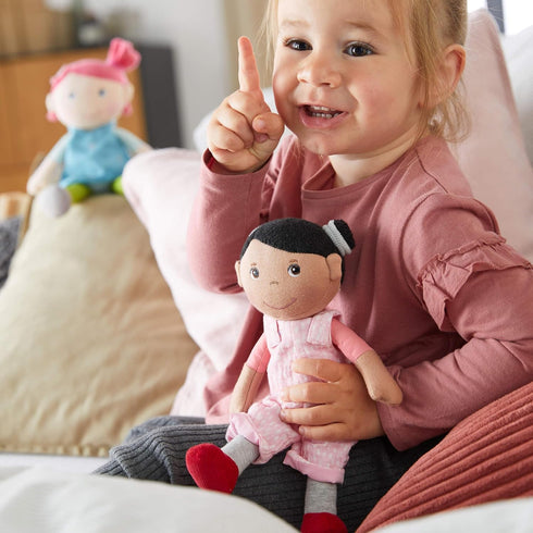 HABA Snug Up Doll Rumbi, 10" Soft Doll with Black Hair and Pink Overalls, Machine Washable for 18 Months and Up