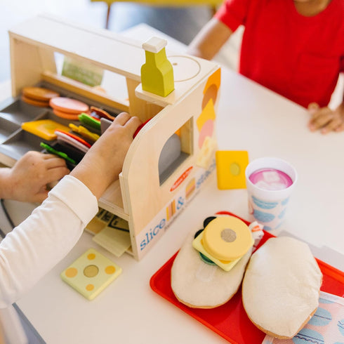 Melissa & Doug Wooden Slice & Stack Sandwich Counter with Deli Slicer – 56-Piece Pretend Play Food Set