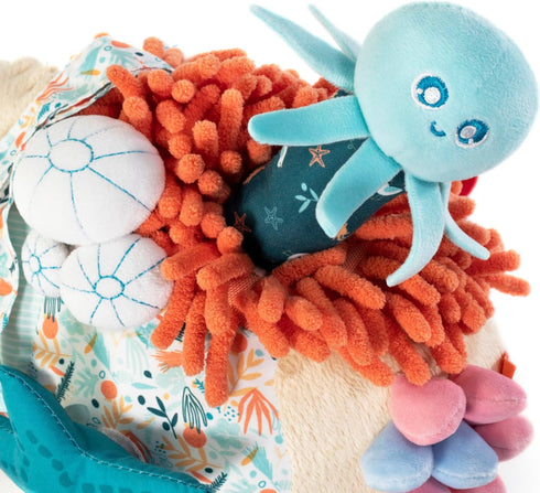 0-6 Miniland Baby Teether, Plush Baby Rattle, Toddler Toy for Teething, Sensory Development and Textured Fun, Fully