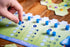 Ammon 12+, 2-4 45+ Gnome Hollow Board Game, Thematic Gnome and Garden Tile Laying & Worker Placement Strategy Game