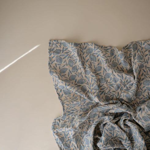 100% mushie Muslin Baby Swaddle Blanket | Organic Cotton (Blue Flowers)