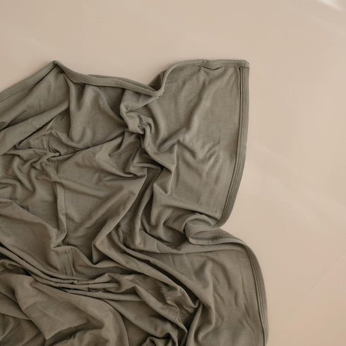 47"x47" mushie Stretchy Baby Swaddle Blanket | Extra Soft & Snug Fit | (Dried Thyme)